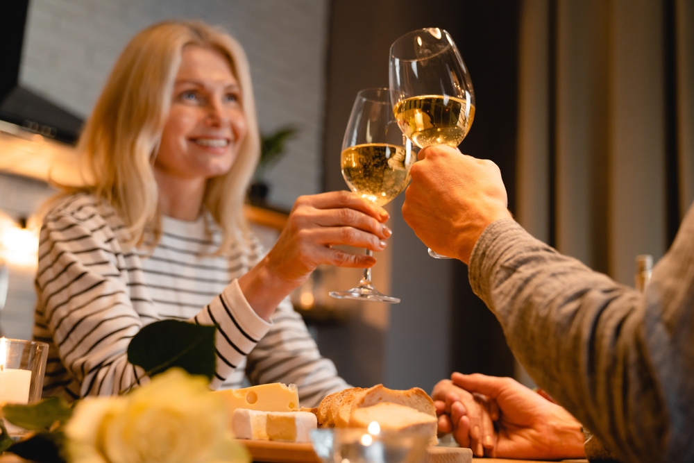 Couple drinking wine as they enjoy one of the most romantic Texas getaways in Granbury